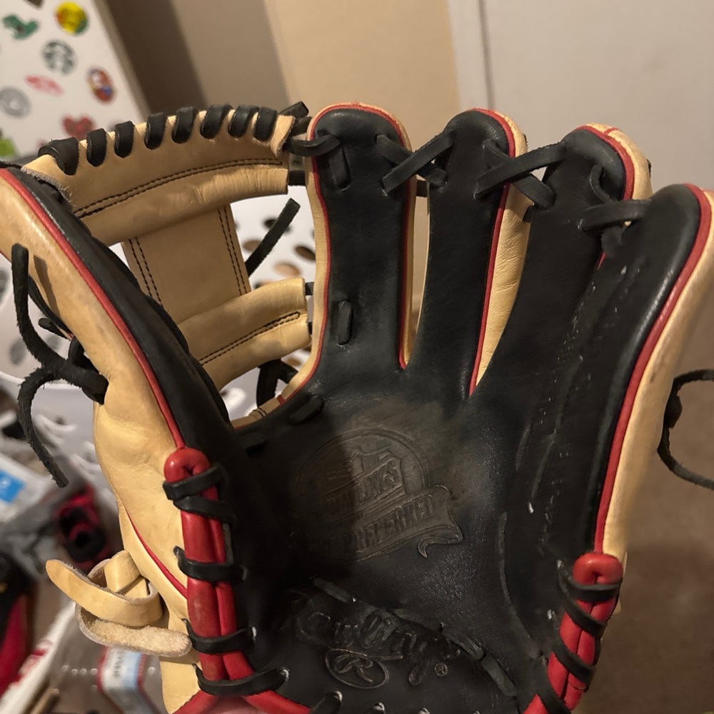 Black and Cream Baseball Glove with Red Accents